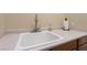 Practical utility sink area with clean countertop, soap, and paper towels at 10370 Sweet Laurel St St, Las Vegas, NV 89178