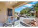 Charming backyard oasis with covered patio, comfortable seating, and tranquil desert landscaping at 10532 Sea Palms Ave, Las Vegas, NV 89134