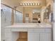 Bathroom with white cabinets, large mirrors, and ample counter space creates a serene atmosphere at 10532 Sea Palms Ave, Las Vegas, NV 89134