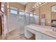 Bright bathroom featuring a glass shower, vanity with great counter space, and natural light at 10532 Sea Palms Ave, Las Vegas, NV 89134