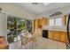 Breakfast nook with light wood cabinetry, a sliding glass door to the patio, and backyard views at 10532 Sea Palms Ave, Las Vegas, NV 89134