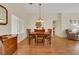 A beautifully staged dining room with hardwood floors and a chandelier at 10532 Sea Palms Ave, Las Vegas, NV 89134