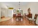 Bright dining area featuring natural light, hardwood floors, a classic dining set, and seamless flow from the entry at 10532 Sea Palms Ave, Las Vegas, NV 89134
