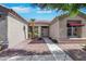 Inviting front entrance with desert landscaping, neutral colors, and a tiled roof at 10532 Sea Palms Ave, Las Vegas, NV 89134
