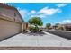 View of a single-story home featuring a two-car garage, desert landscaping, and a paved driveway at 10532 Sea Palms Ave, Las Vegas, NV 89134