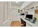 Functional home office with built-in shelves and laminate wood flooring at 10532 Sea Palms Ave, Las Vegas, NV 89134