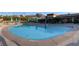 Large community pool with seating areas and mountain views at 10532 Sea Palms Ave, Las Vegas, NV 89134