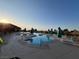 Inviting community pool with lounge chairs and umbrellas, perfect for relaxation at 10532 Sea Palms Ave, Las Vegas, NV 89134