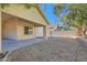 Covered patio and neutral backyard landscaping, offering a serene and low-maintenance outdoor space at 10667 Casa Bianca St, Las Vegas, NV 89141