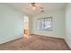 Spacious bedroom with a window providing natural light and a view of the outdoors at 10667 Casa Bianca St, Las Vegas, NV 89141