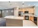 Bright kitchen featuring an island, stainless steel appliances, and light wood cabinetry at 10667 Casa Bianca St, Las Vegas, NV 89141