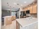 Modern kitchen with stainless steel appliances, stone countertops, and pendant lighting at 10667 Casa Bianca St, Las Vegas, NV 89141