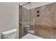 Modern bathroom with tiled shower featuring glass door, and updated fixtures at 11014 Great Sioux Rd, Las Vegas, NV 89179