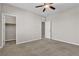 Spacious bedroom with carpet, a ceiling fan, and an open closet at 11014 Great Sioux Rd, Las Vegas, NV 89179