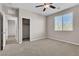 Well-lit bedroom offering neutral colors and a ceiling fan at 11014 Great Sioux Rd, Las Vegas, NV 89179