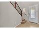 Bright entryway featuring tile floors, staircase with wooden banister, and a decorative glass front door at 11014 Great Sioux Rd, Las Vegas, NV 89179