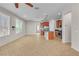 Open-concept living space with kitchen area featuring tile flooring, ample light and modern finishes at 11014 Great Sioux Rd, Las Vegas, NV 89179