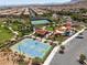 Aerial view of community amenities including a basketball court, tennis courts, playground, and walking trails at 11256 Rainbow Peak Ave # 202, Las Vegas, NV 89135