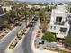Inviting street view in a vibrant community, complete with lush palm trees at 11256 Rainbow Peak Ave # 202, Las Vegas, NV 89135