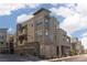 Modern apartment building exterior with gray tones, private garages, and street parking at 11256 Rainbow Peak Ave # 202, Las Vegas, NV 89135