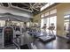 Well-equipped fitness center with treadmills, weights, and mirrored walls at 11256 Rainbow Peak Ave # 202, Las Vegas, NV 89135