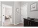 Hallway view leading to a bedroom, showcasing the home's neutral color palette and open layout at 11256 Rainbow Peak Ave # 202, Las Vegas, NV 89135