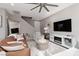 Open living room area featuring a large TV and a modern electric fireplace at 11256 Rainbow Peak Ave # 202, Las Vegas, NV 89135