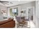 Open-concept living and dining area features elegant decor and abundant natural light from a large sliding glass door at 11256 Rainbow Peak Ave # 202, Las Vegas, NV 89135