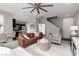 A comfortable and open living room space with a modern kitchen view and great lighting at 11256 Rainbow Peak Ave # 202, Las Vegas, NV 89135