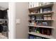 Well-stocked pantry with ample shelving, located right off the kitchen for easy access at 11256 Rainbow Peak Ave # 202, Las Vegas, NV 89135