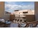 Relaxing outdoor patio with comfortable seating and views of the surrounding neighborhood, perfect for leisure at 11256 Rainbow Peak Ave # 202, Las Vegas, NV 89135