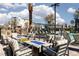 Relaxing poolside lounge area with comfortable seating and fire pits for evening gatherings at 11256 Rainbow Peak Ave # 202, Las Vegas, NV 89135
