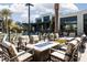Charming poolside seating area with fire pits and plenty of lounge chairs for residents at 11256 Rainbow Peak Ave # 202, Las Vegas, NV 89135