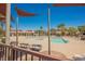Community pool with multiple pools and seating areas under a bright blue sky at 1180 Via Vinci, Henderson, NV 89052