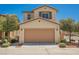 Two-story home with a two car garage and well-manicured landscaping on a beautiful sunny day at 1180 Via Vinci, Henderson, NV 89052
