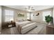 Cozy main bedroom with neutral tones, ample natural light, comfortable furnishings, and serene ambiance at 1180 Via Vinci, Henderson, NV 89052
