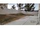 Wide shot of the backyard featuring a concrete patio and block wall perimeter at 1211 Silver Knoll Ave, Las Vegas, NV 89123