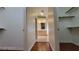 View of walk-in closets, hardwood floors, and entry to bathroom with dual sinks and vanity at 1211 Silver Knoll Ave, Las Vegas, NV 89123