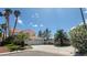 Charming two-story home features a three-car garage, desert landscaping, and a tile roof at 1211 Silver Knoll Ave, Las Vegas, NV 89123