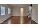Spacious living room with hardwood flooring and large windows providing natural light at 1211 Silver Knoll Ave, Las Vegas, NV 89123