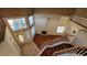 View from the staircase showing a fireplace, hardwood floors, chandelier, and tiled entryway at 1211 Silver Knoll Ave, Las Vegas, NV 89123
