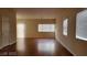 Bright living room featuring hardwood floors and large windows at 1211 Silver Knoll Ave, Las Vegas, NV 89123