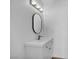 Modern bathroom featuring a sleek vanity, updated mirror, and new lighting at 1424 Santa Anita Dr # D, Las Vegas, NV 89119