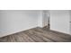 A minimalist bedroom showcases wood-look flooring, white walls, and an ensuite at 1424 Santa Anita Dr # D, Las Vegas, NV 89119