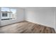Bright bedroom features wood-look flooring and a large window for natural light at 1424 Santa Anita Dr # D, Las Vegas, NV 89119