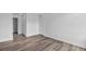 This bedroom features wood-look flooring, white walls, and a closet for storage at 1424 Santa Anita Dr # D, Las Vegas, NV 89119