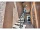 Exterior stairway leading to upper-level units, adjacent to parking area at 1424 Santa Anita Dr # D, Las Vegas, NV 89119