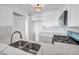 Bright kitchen features new appliances, marble countertops, and white cabinets at 1424 Santa Anita Dr # D, Las Vegas, NV 89119