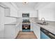 Bright kitchen features new appliances, marble countertops, and white cabinets at 1424 Santa Anita Dr # D, Las Vegas, NV 89119