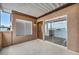 Covered patio with sliding glass doors leading to the interior, and textured walls at 1424 Santa Anita Dr # D, Las Vegas, NV 89119